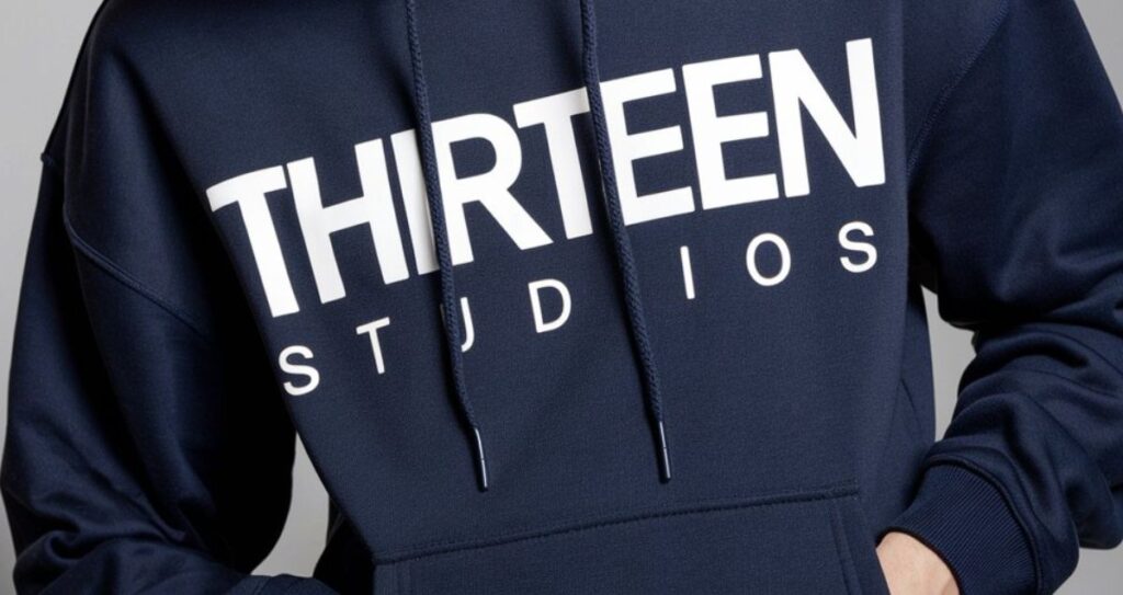 The Thirteen Studios Hoodie With Blue Text: A Stylish Statement in Streetwear