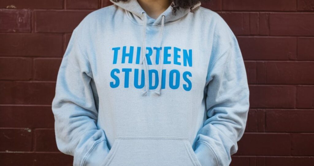 Why the Thirteen Studios Hoodie With Blue Text is a Must-Have in Your Wardrobe